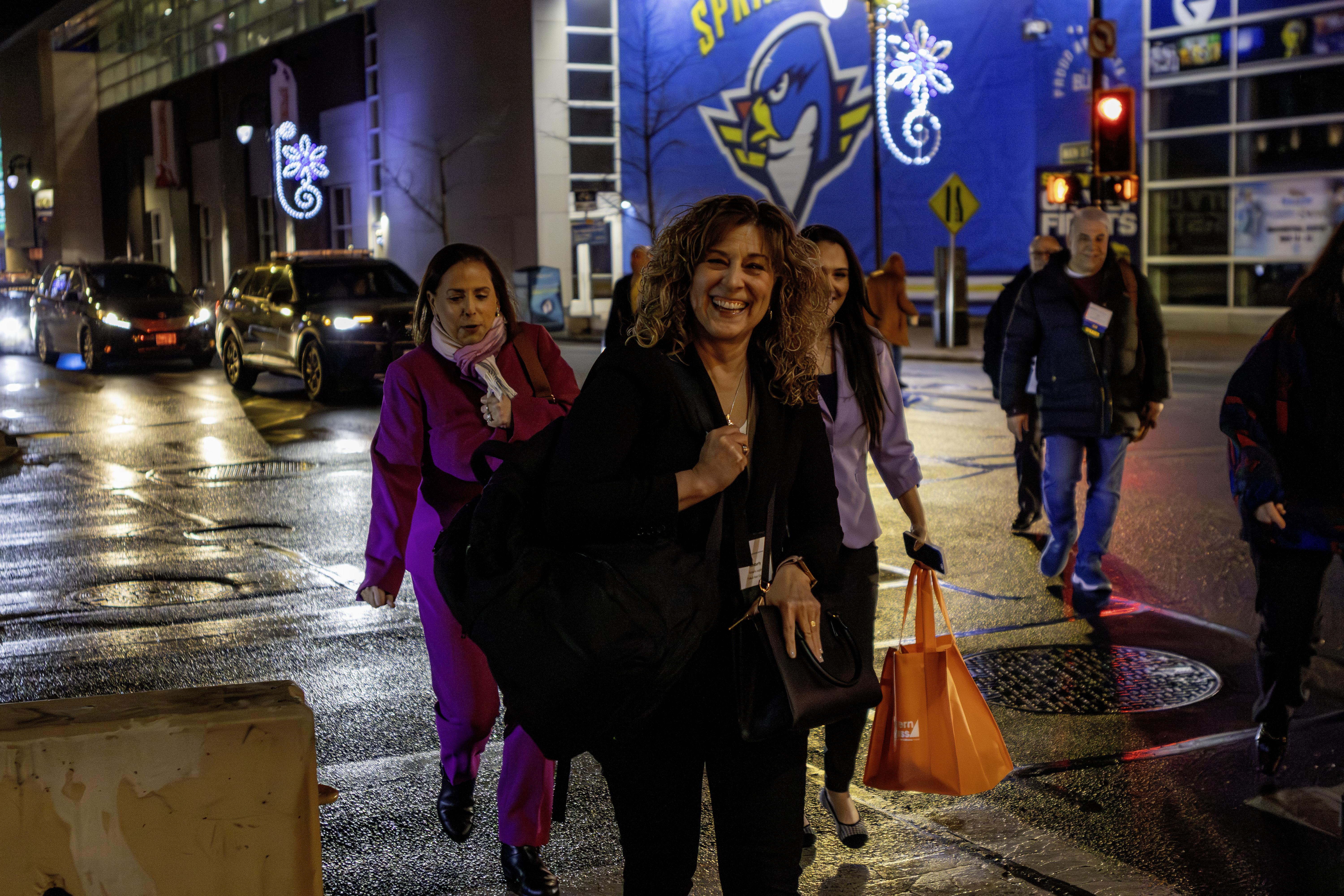 NESAE woman walking across street.jpg